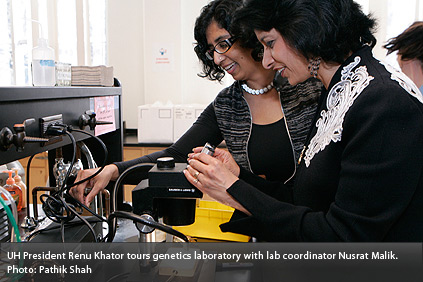 UH President Renu Khator tours genetics laboratory with lab coordinator Nusrat Malik